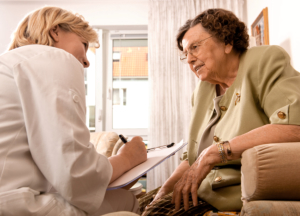 caregiver talking to the senior woman